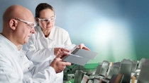 People with white coats in the lab People with white coats in the lab