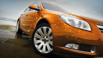 Orange car model with digital visuals 