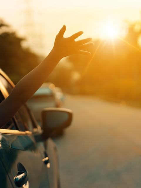 Waving arm from a moving car