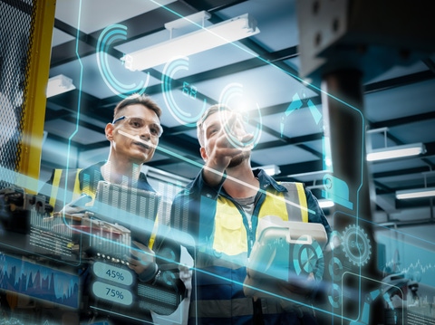 Two hands holding a spectrophotometer on an orange car