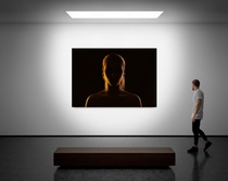 A man walks on the exhibition hall and examines the gallery of the exhibition A man walks on the exhibition hall and examines the gallery of the exhibition