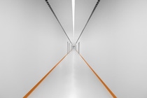 Long white corridor is illuminated by BASF BatWing